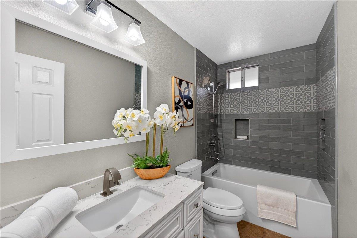 244 Rachael Place Pleasanton, CA 94566 - Photo 15 of 24 a bath room with a toilet sink and shower