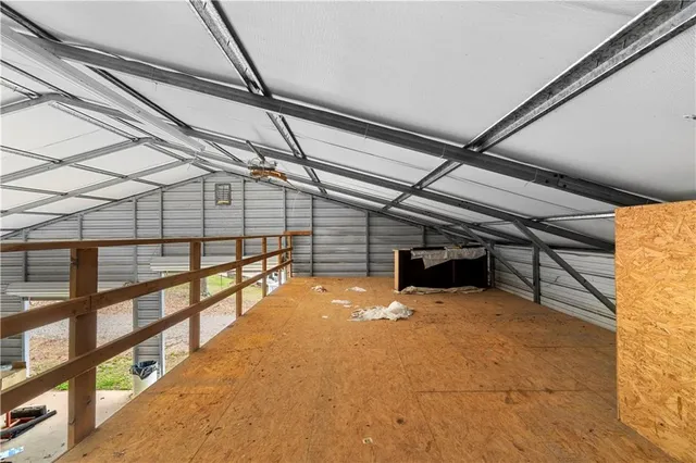 a view of a room with a table and chairs