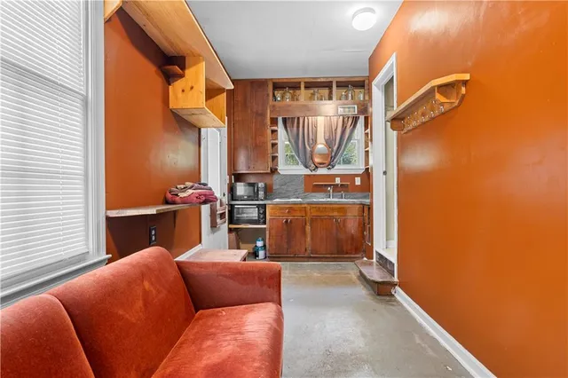 a kitchen with stainless steel appliances granite countertop a sink and cabinets