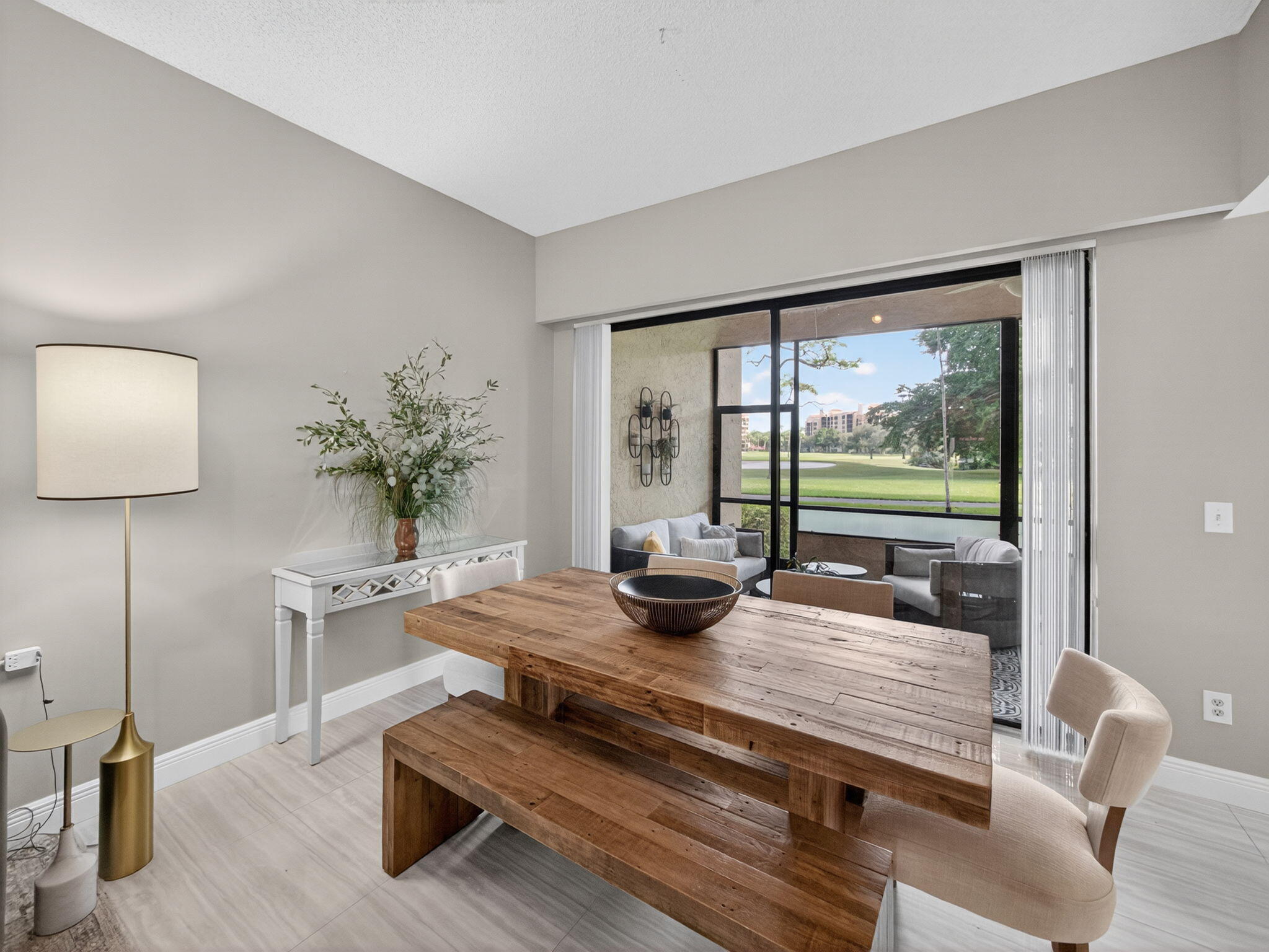 7472 La Paz Boulevard, Unit 109 Boca Raton, FL 33433 - Photo 7 of 29 a dining room with furniture and a potted plant