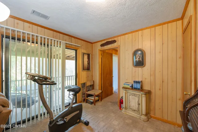 a view of a room with wooden floor and outdoor space