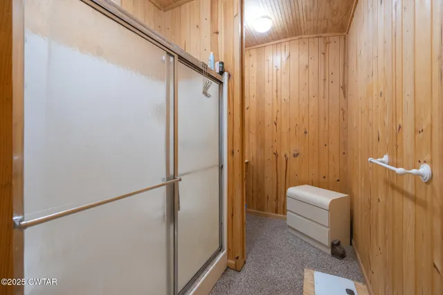 a view of a patio with table and chairs and potted plants