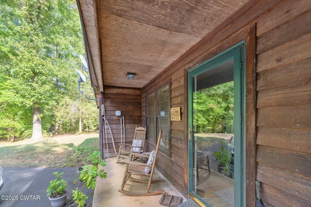 a living room filled with furniture and a table