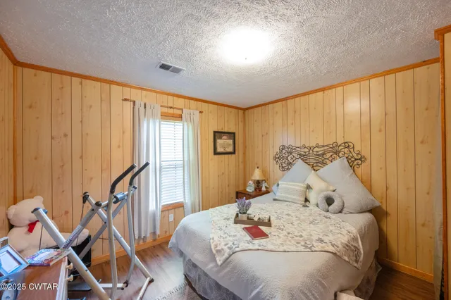 a bathroom with a double vanity sink mirror and shower