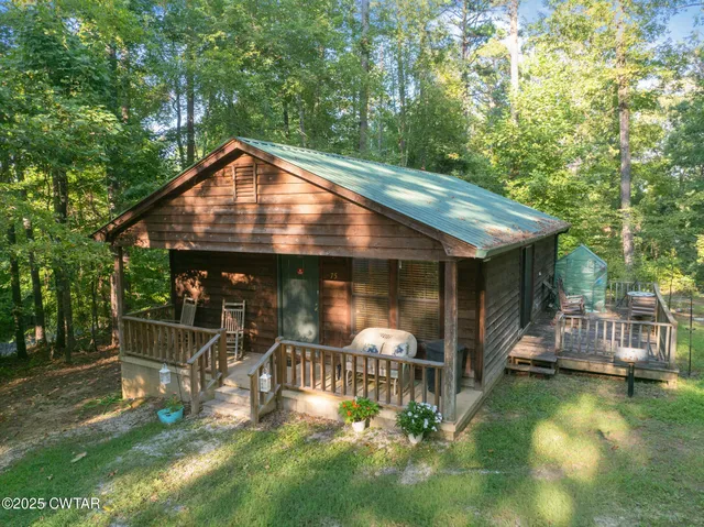 a view of a chair and table in the patio