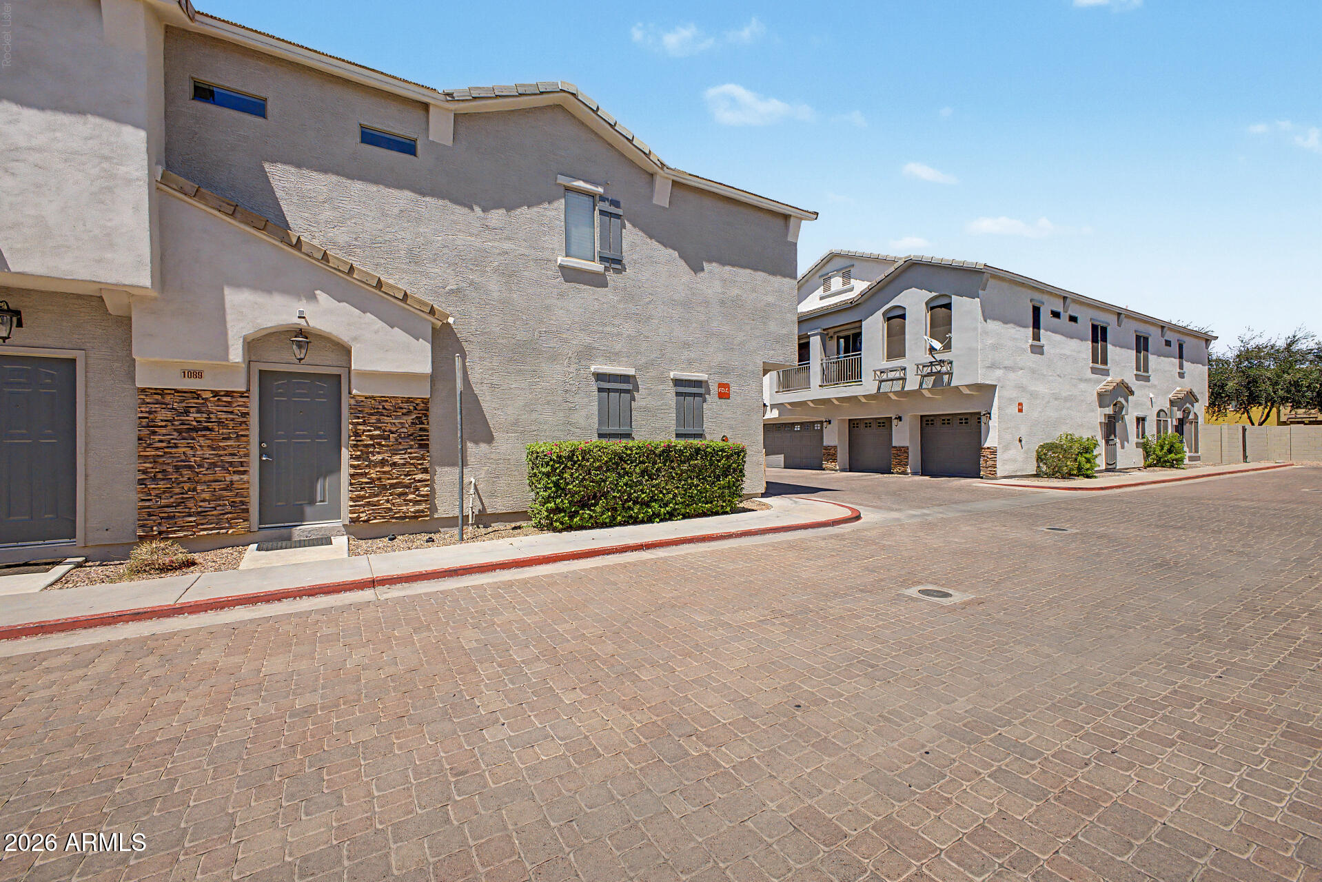 2150 East Bell Road, Unit 1089 Phoenix, AZ 85022 - Photo 3 of 20 front view of a house with a street