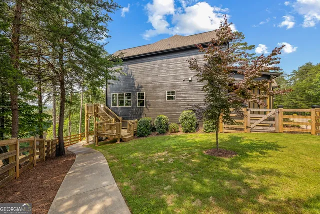 a front view of a house with potted plants