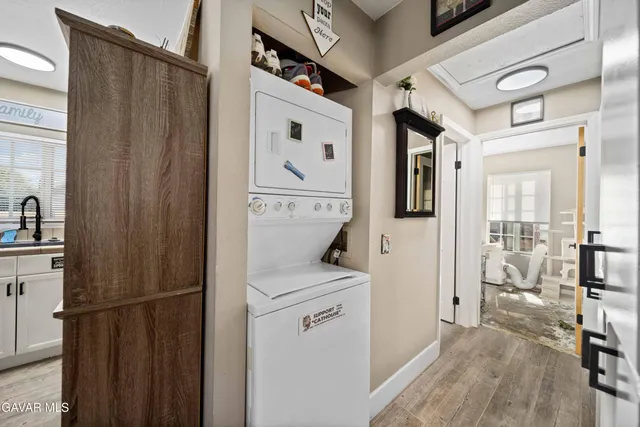 a utility room with closet dryer and washer