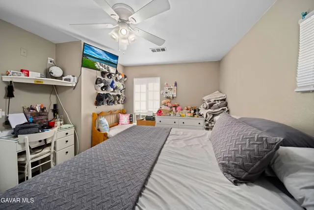 a room with a bed and a chandelier