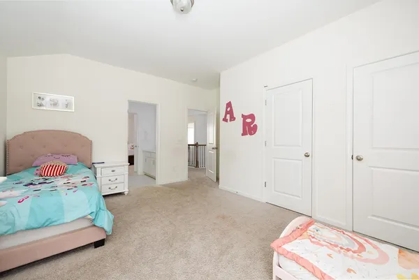 a bed room with a bed and a couch