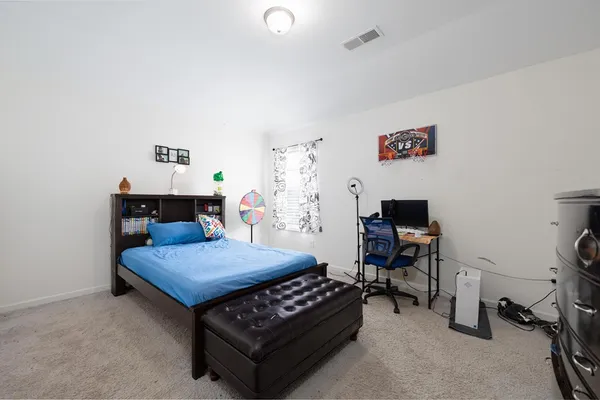 a bathroom with a sink a toilet a mirror a bathtub and shower