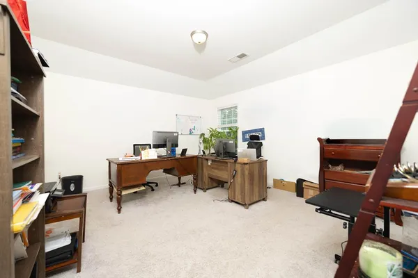 a living room with a flat screen tv and a fireplace