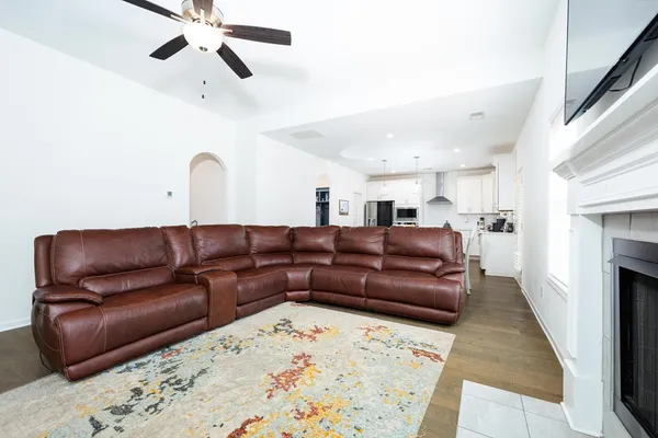 a living room with a couch and a fireplace
