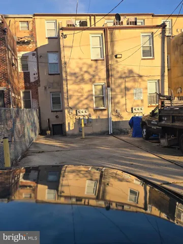 a view of living room with a floor to ceiling window and wooden floor