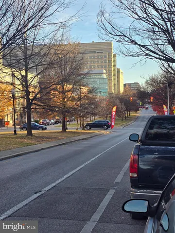 a view of a street with cars