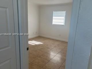 1680 Northeast 5th Street Homestead, FL 33033 - Photo 12 of 26 a view of an empty room with a window