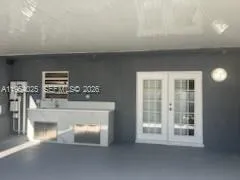 a view of kitchen with furniture and large window