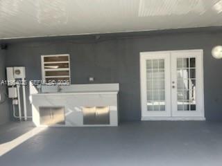 1680 Northeast 5th Street Homestead, FL 33033 - Photo 24 of 26 a living room with furniture and a window