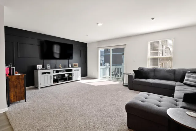 a bedroom with furniture and a wooden floor