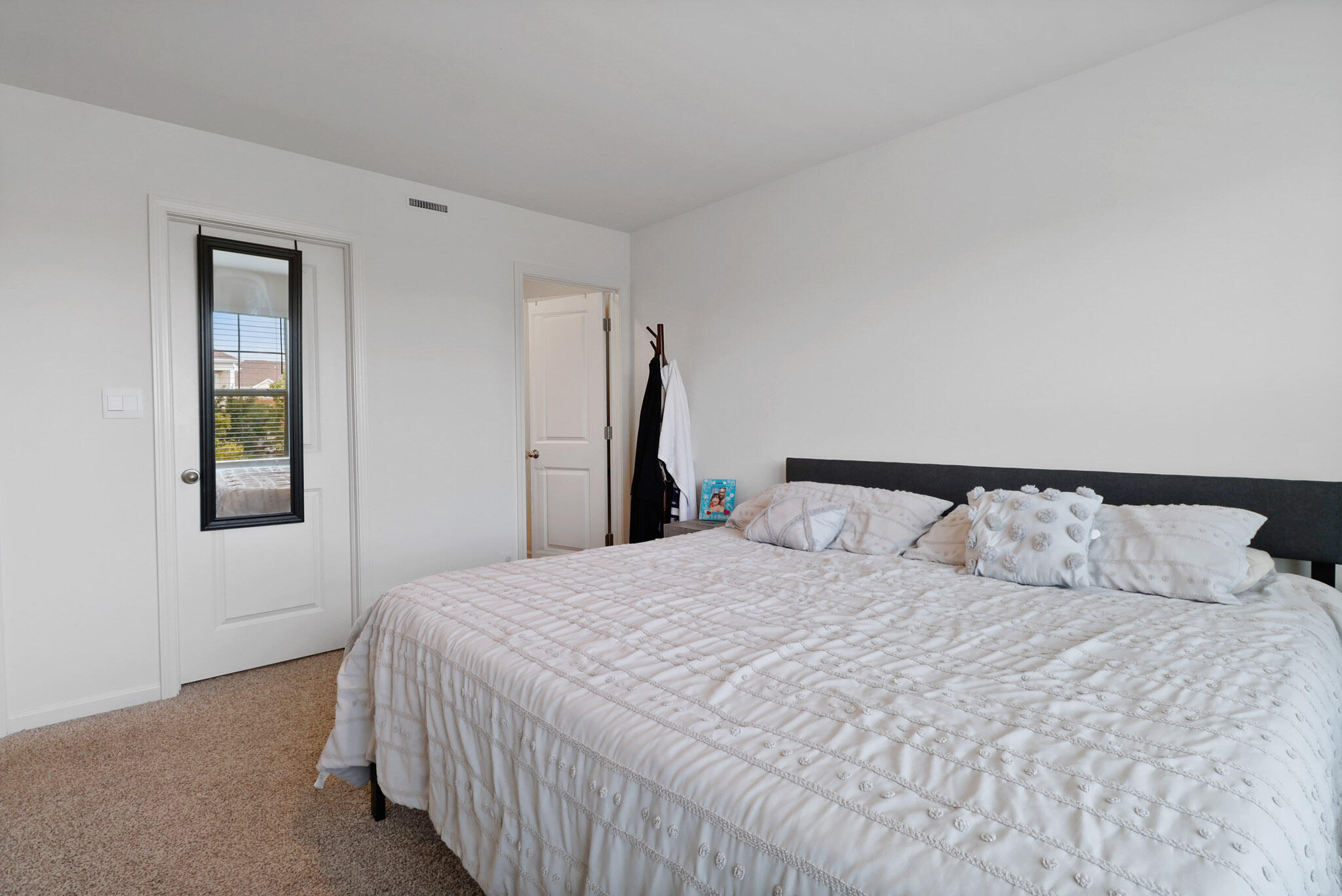 10743 Violette Way St. John, IN 46373 - Photo 16 of 23 a bedroom with a bed and a window
