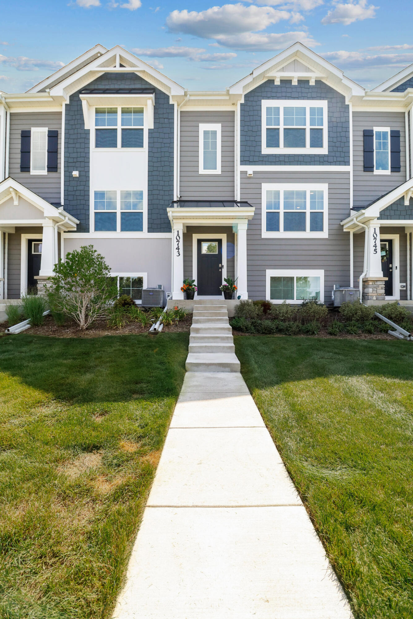 10743 Violette Way St. John, IN 46373 - Photo 23 of 23 a front view of a building with garden