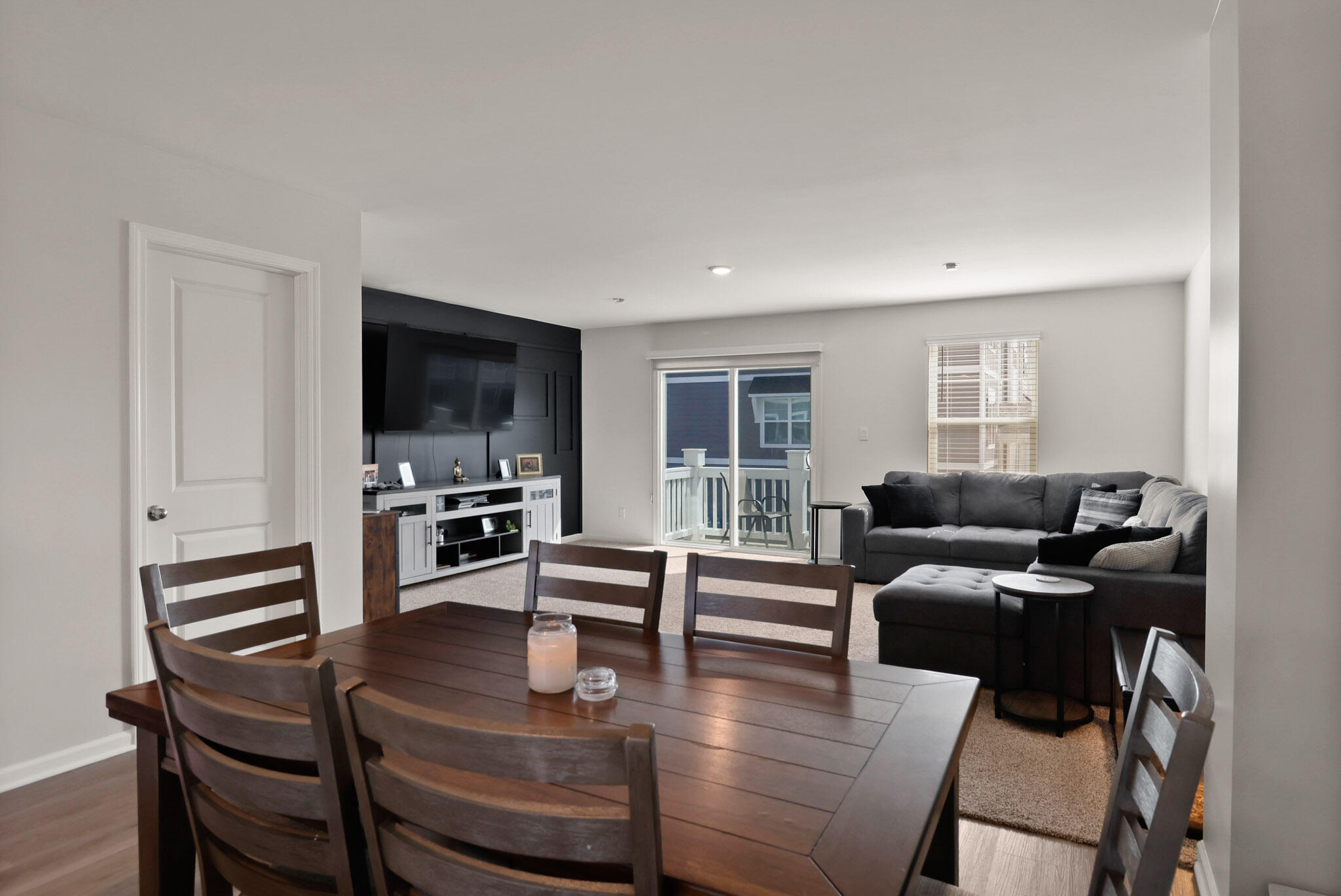10743 Violette Way St. John, IN 46373 - Photo 10 of 23 a living room with furniture a flat screen tv and kitchen view