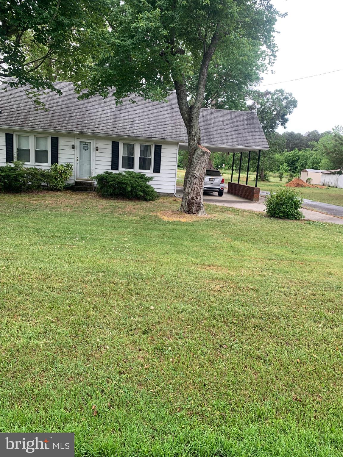 1007 Hudson Road Cambridge, MD 21613 - Photo 2 of 16 Charming home with lush green lawn.