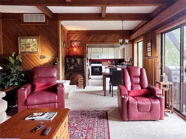 a kitchen with a table chairs and a stove