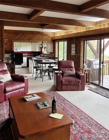 a living room with furniture and a table