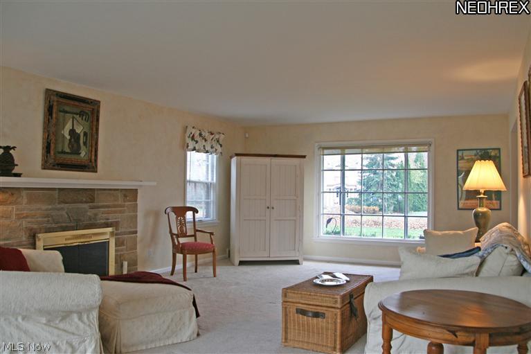 184 Overwood Road Akron, OH 44313 - Photo 4 of 24 Fireplace with stone surround, three exposures and neutral colors make this a fabulous room for all occasions.