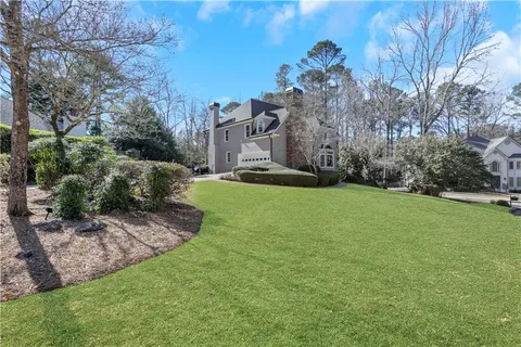 a backyard of a house with lots of green space