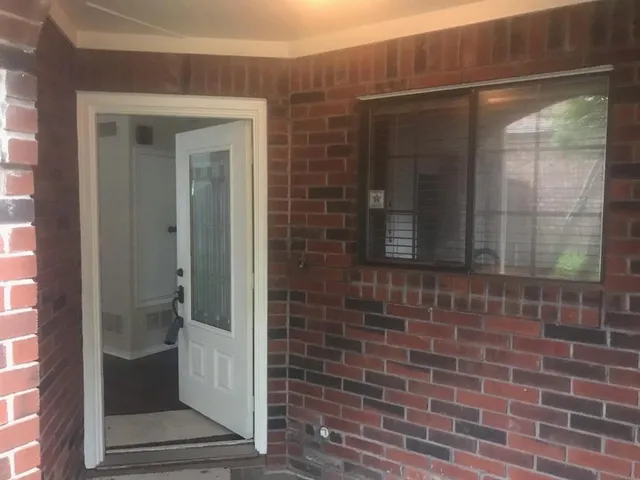 a bathroom with a shower and a sink