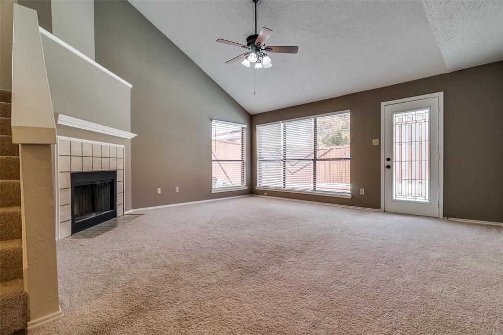 6804 Century Circle Plano, TX 75023 - Photo 4 of 13 a view of an empty room with a fireplace and a window