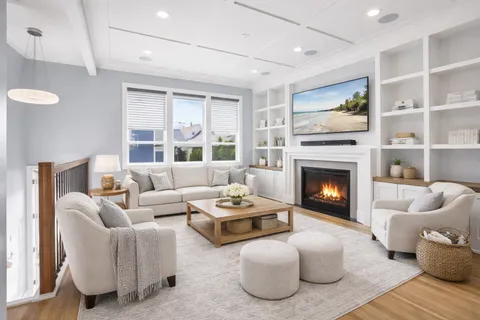 a view of a livingroom with an empty space and a fireplace