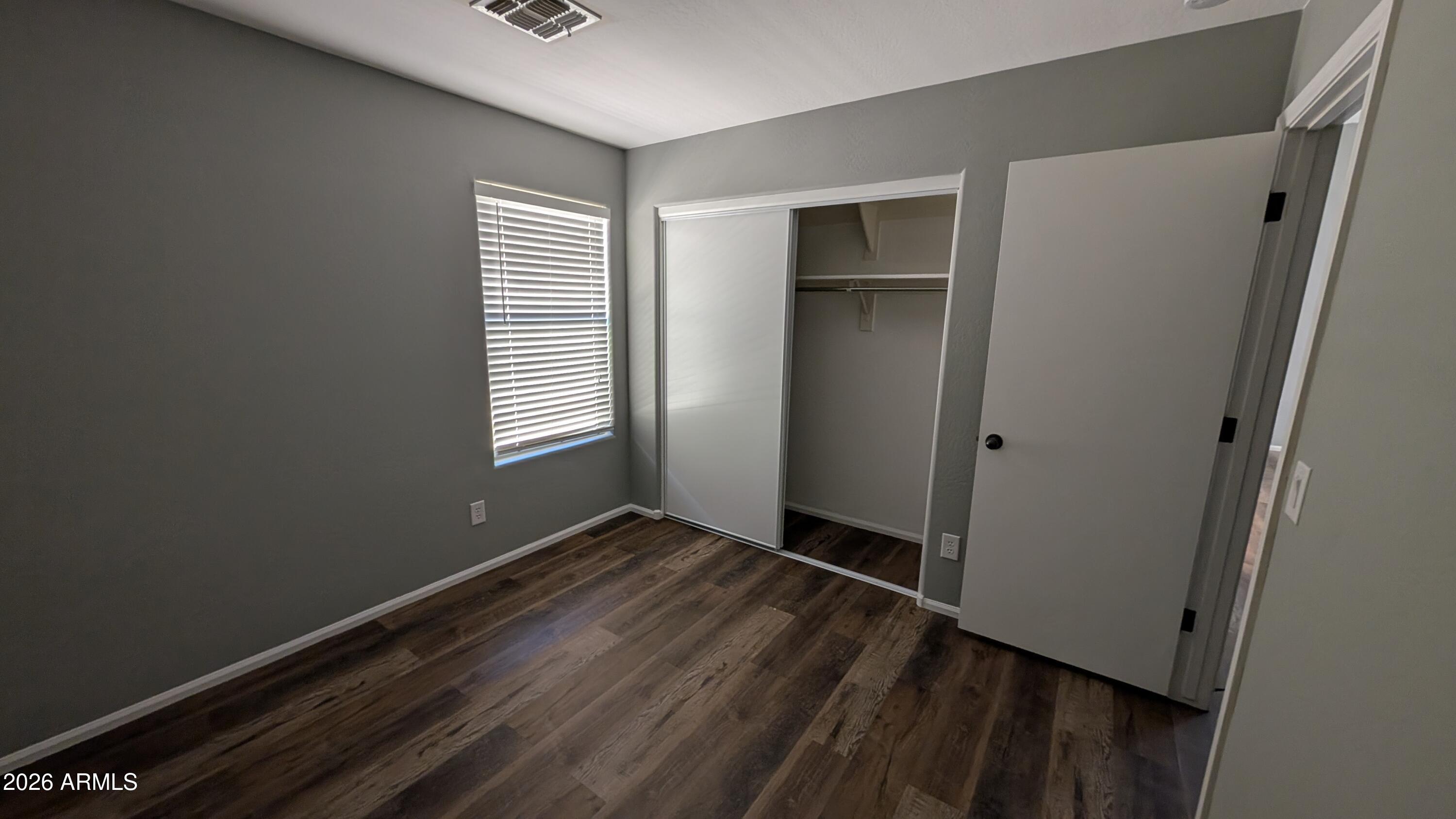 1377 East Pryor Road San Tan Valley, AZ 85140 - Photo 16 of 31 a view of an empty room with closet and a window
