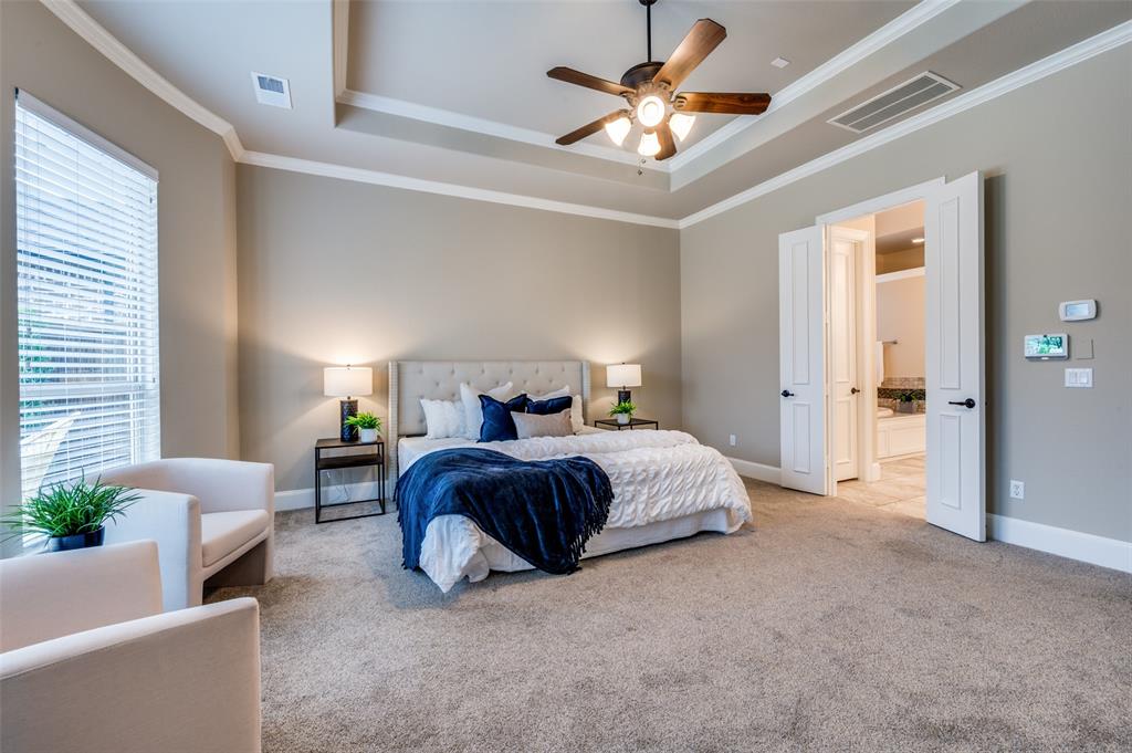 2168 Dampton Drive Frisco, TX 75033 - Photo 14 of 31 a bedroom with bed and a chandelier