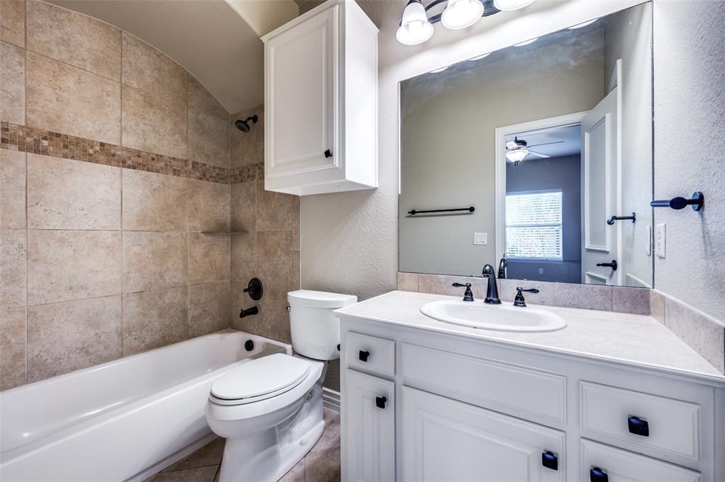 2168 Dampton Drive Frisco, TX 75033 - Photo 20 of 31 a bathroom with a sink a toilet and a bathtub
