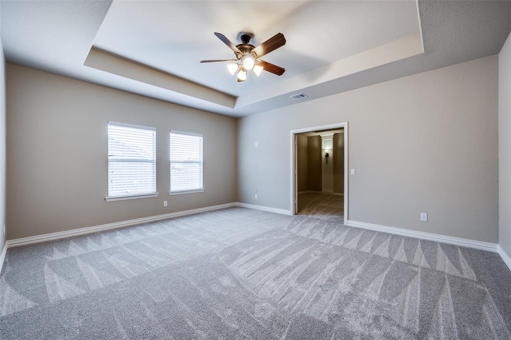 2168 Dampton Drive Frisco, TX 75033 - Photo 21 of 31 a view of an empty room with window and a ceiling fan