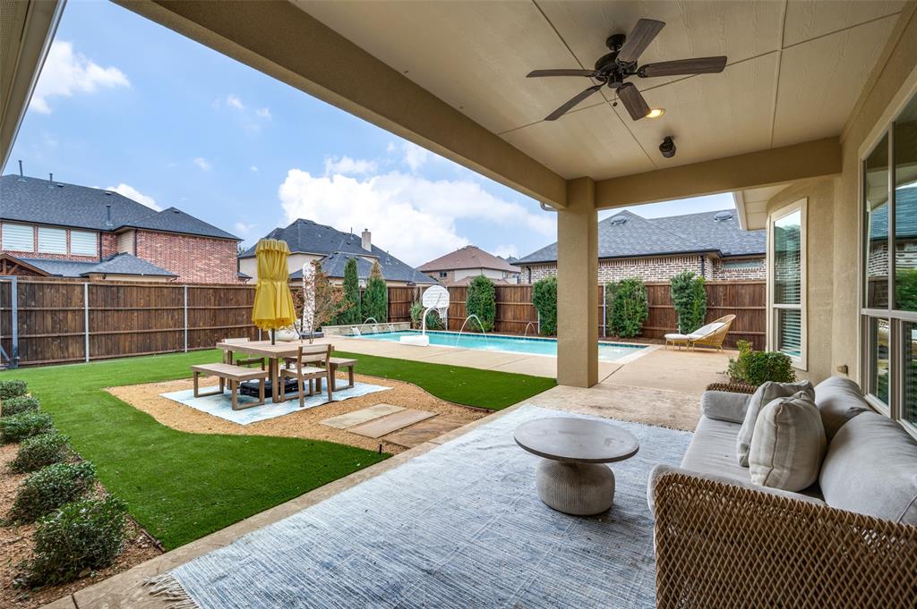 2168 Dampton Drive Frisco, TX 75033 - Photo 25 of 31 a view of a patio with couches chairs and a yard