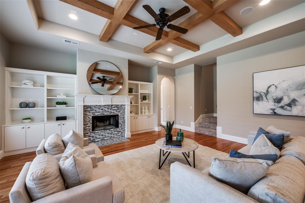 2168 Dampton Drive Frisco, TX 75033 - Photo 4 of 31 a living room with furniture and a fireplace