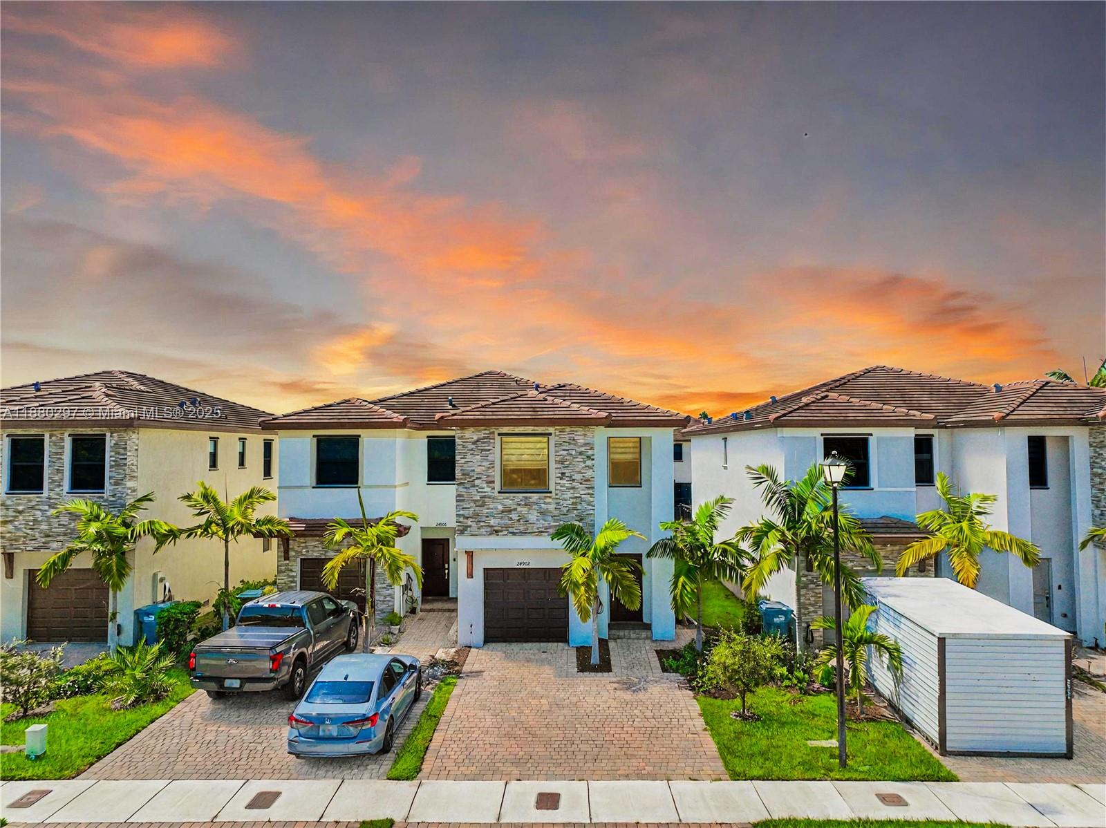 24902 Southwest 107th Avenue Homestead, FL 33032 - Photo 1 of 73 a view of a house with a patio