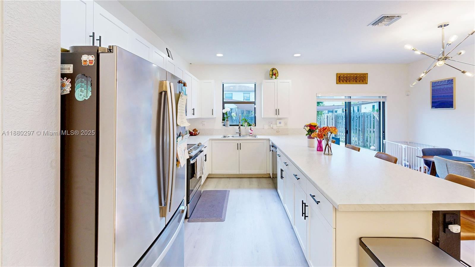 24902 Southwest 107th Avenue Homestead, FL 33032 - Photo 12 of 73 a kitchen with stainless steel appliances a refrigerator and a sink