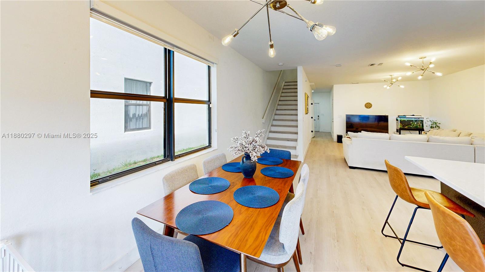24902 Southwest 107th Avenue Homestead, FL 33032 - Photo 21 of 73 a dining room with furniture and a large window