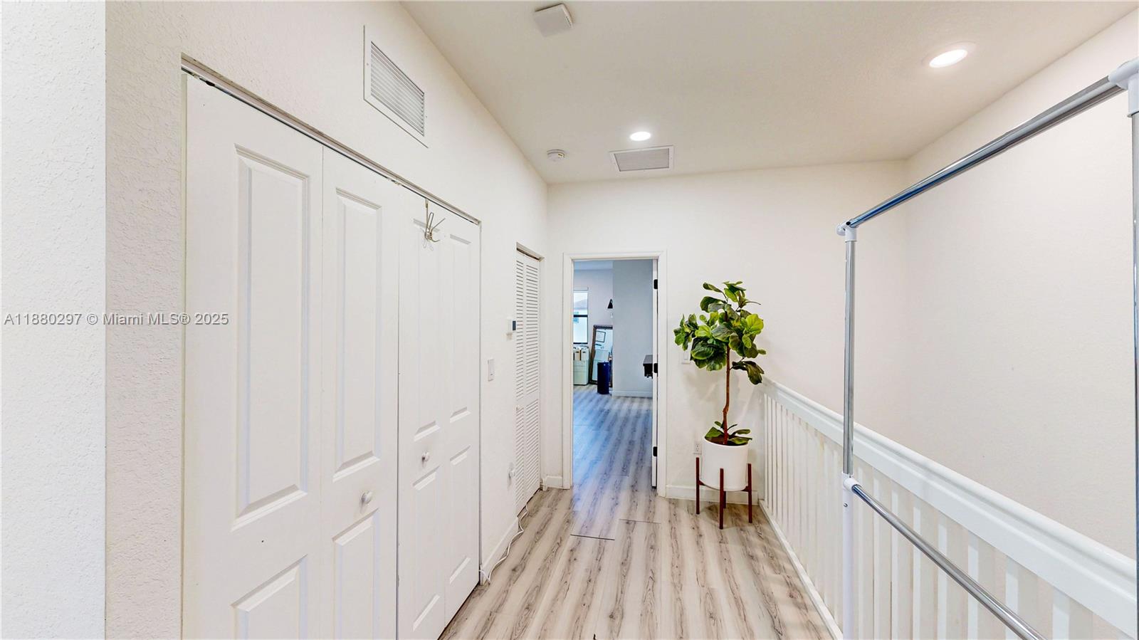 24902 Southwest 107th Avenue Homestead, FL 33032 - Photo 23 of 73 a view of a hallway with wooden floor and staircase