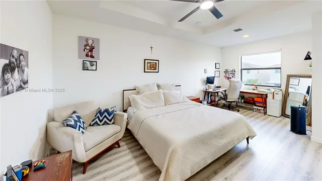 a bathroom with a toilet a sink and a mirror