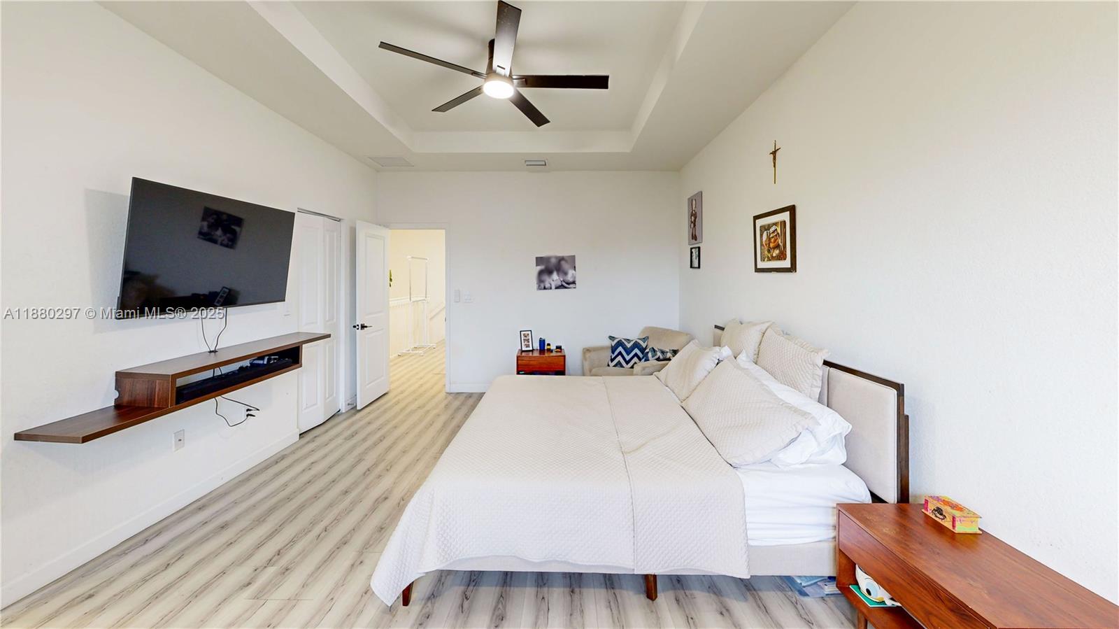 24902 Southwest 107th Avenue Homestead, FL 33032 - Photo 29 of 73 a bedroom with a bed and a flat screen tv