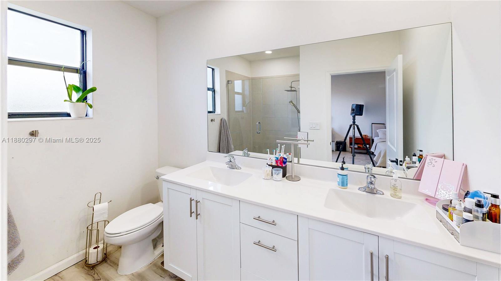 24902 Southwest 107th Avenue Homestead, FL 33032 - Photo 31 of 73 a bathroom with a toilet a sink and a mirror