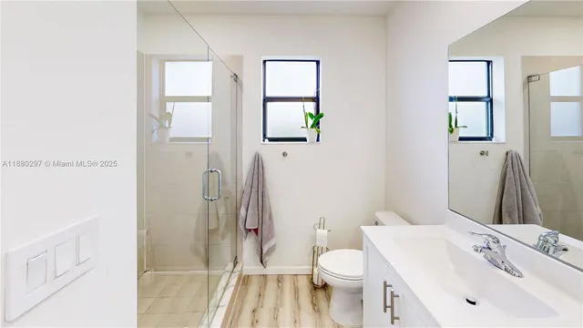 a bedroom that has a bed and a chair in it