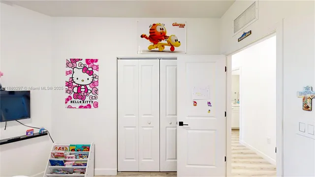 a view of storage and utility room with washer and dryer