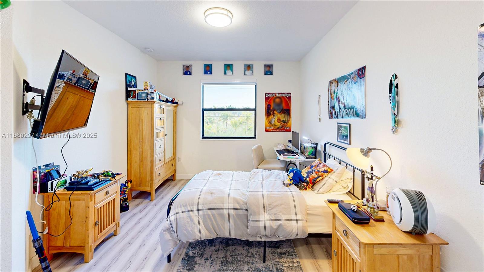 24902 Southwest 107th Avenue Homestead, FL 33032 - Photo 38 of 73 a bedroom that has a bed and a chair in it